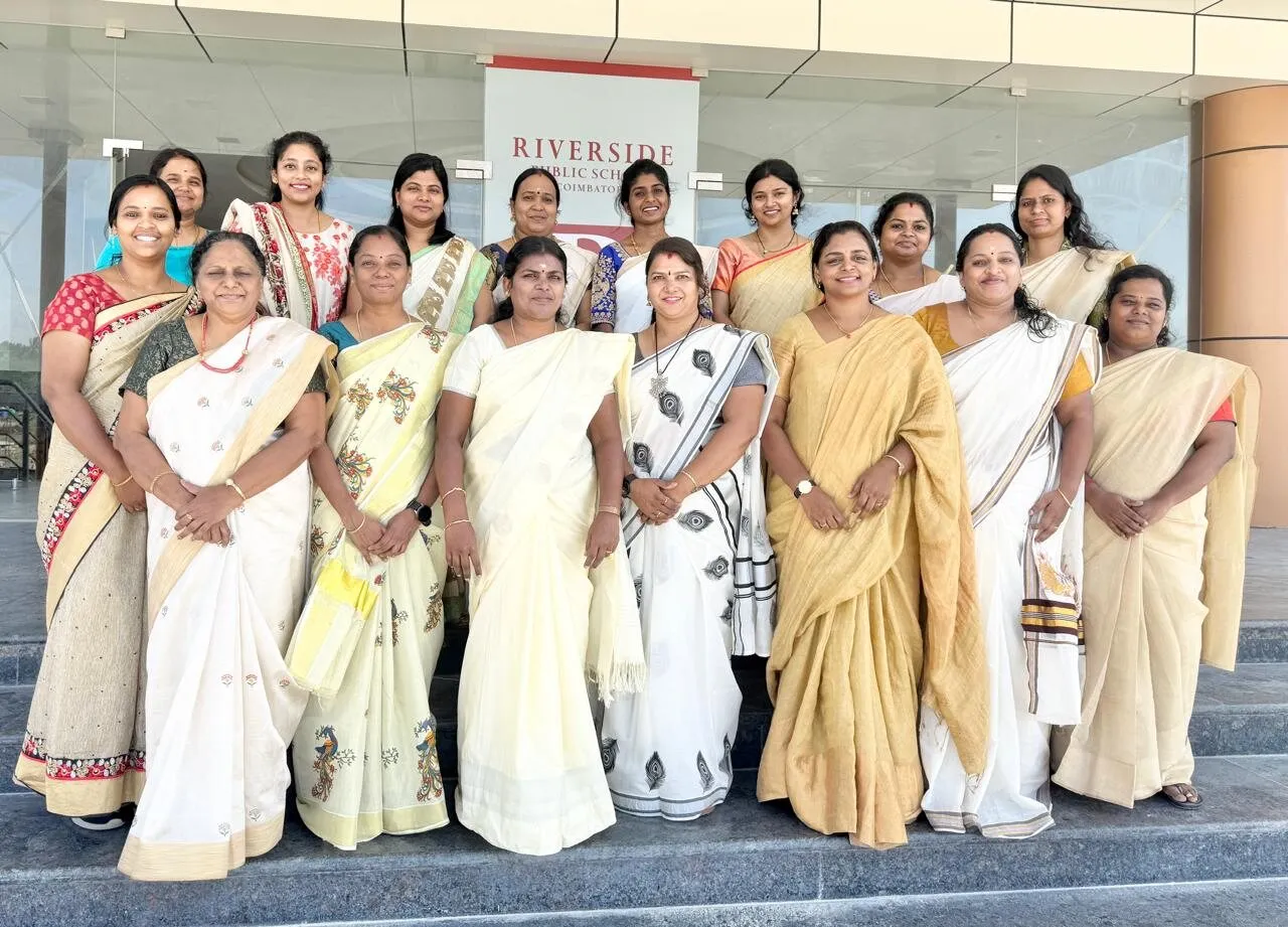 The teaching team of Riverside Public School, Coimbatore, photographed together on the steps of the school entrance